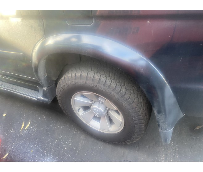 REAR LEFT OVERFENDER WHEEL ARCH TRIM FOR A MITSUBISHI EXTERIOR - 