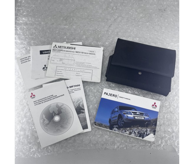 SHOGUN PAJERO OWNERS MANUAL AND CASE FOR A MITSUBISHI V70# - PLATE & LABEL
