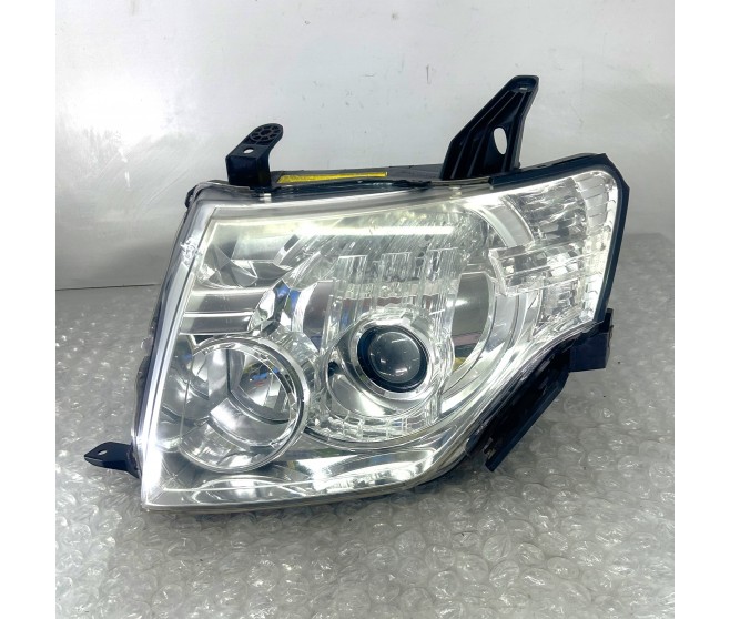 FRONT LEFT XENON HEADLAMP BROKEN PLASTIC FOR A MITSUBISHI CHASSIS ELECTRICAL - 