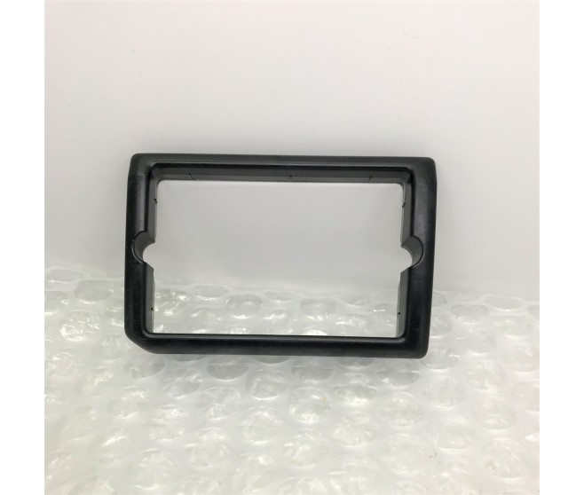 REAR LEFT BUMPER LAMP BEZEL FOR A MITSUBISHI CHASSIS ELECTRICAL - 