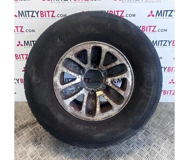 ALLOY WHEEL AND TYRE FOR A MITSUBISHI PAJERO - V36W