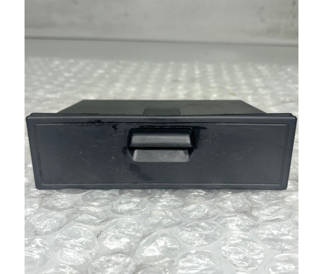 UNDER STEREO ACCESORY BOX FOR A MITSUBISHI PAJERO/MONTERO - V24W