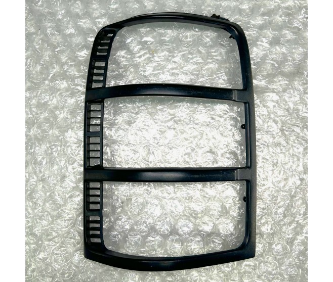 LIGHT BEZEL REAR LEFT FOR A MITSUBISHI CHASSIS ELECTRICAL - 