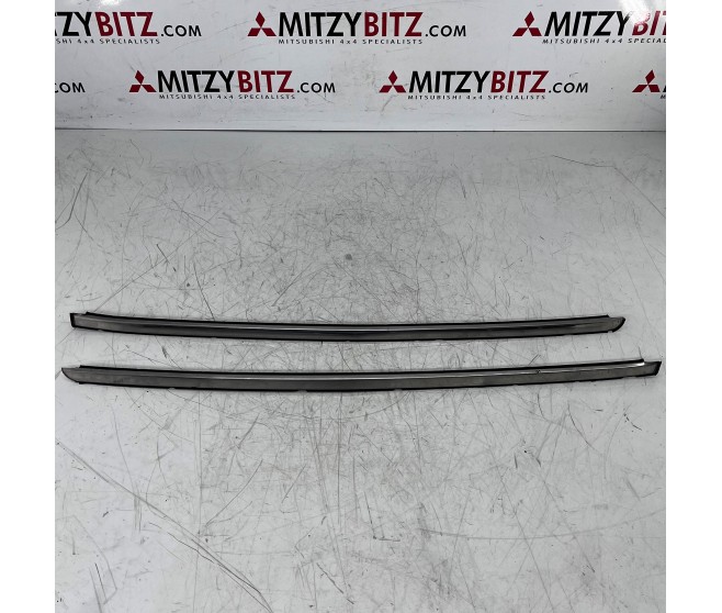 RIGHT AND LEFT WINDSHIELD SIDE MOULDINGS FOR A MITSUBISHI V20-50# - RIGHT AND LEFT WINDSHIELD SIDE MOULDINGS