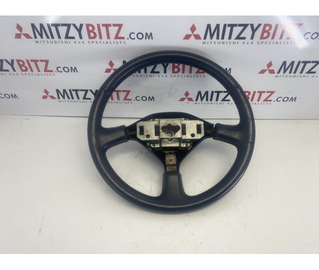 BLUE LEATHER STEERING WHEEL FOR A MITSUBISHI PAJERO - V23W