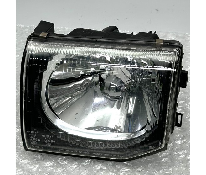 FRONT LEFT HEADLAMP CLEAR LENS FOR A MITSUBISHI PAJERO - V45W
