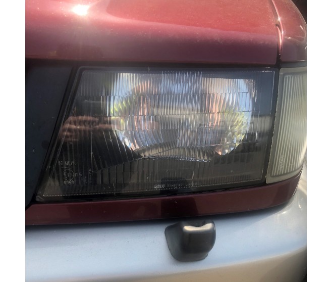 FRONT LEFT HEADLIGHT FOR A MITSUBISHI CHASSIS ELECTRICAL - 