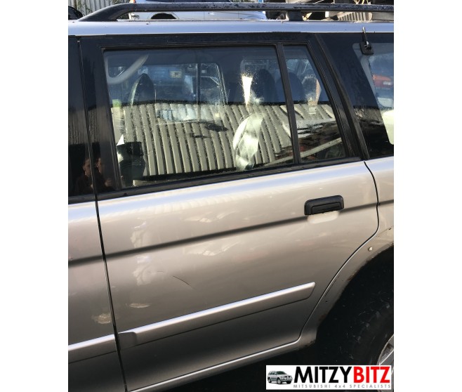 REAR LEFT SILVER BARE DOOR PANEL ONLY FOR A MITSUBISHI MONTERO SPORT - K86W