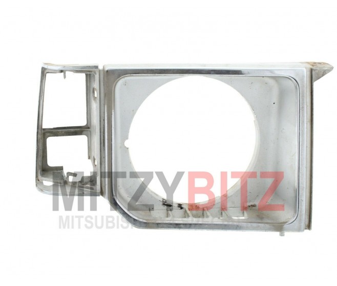 BLACK FRONT RIGHT HEAD LAMP LIGHT INDICATOR BEZEL FOR A MITSUBISHI BODY - 
